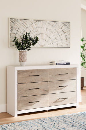  this dresser brings casual beauty and function to your dream destination. You-'re sure to love its six spacious drawers that easily glide open and offer plenty of storage for your wardrobe and spare bed linens. A delightful two-tone 