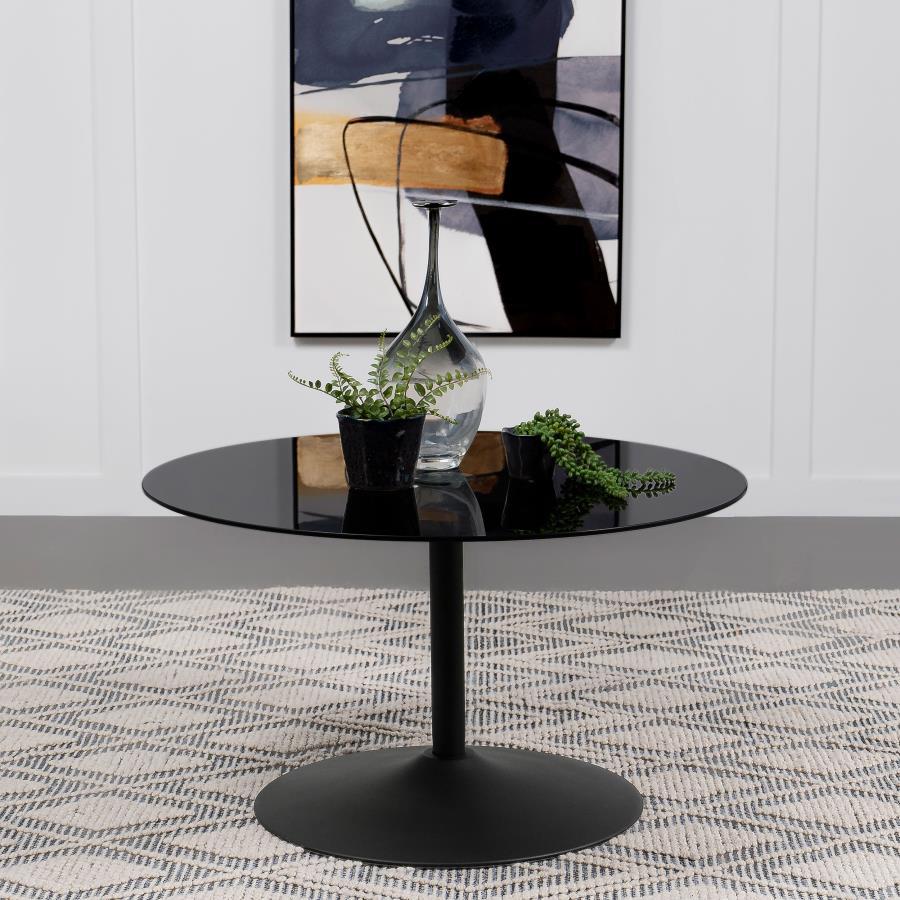 This modern coffee table showcases a sleek round design with a black tempered glass top, offering durability and style. The metal tulip base features a black powder-coated finish, creating a seamless and contemporary aesthetic. Perfect for living room set