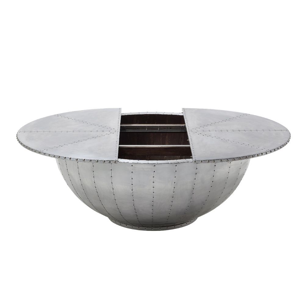 Looking for cutting-edge style? The industrial Brancaster round coffee table is the perfect conversation piece. With features like aluminum patchwork with rich overtones and convenient, discrete storage, this unusual coffee table is sure to impress.<br/><