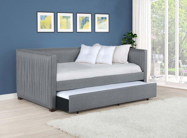  pleated and overlapping along the surface of this twin daybed and trundle set