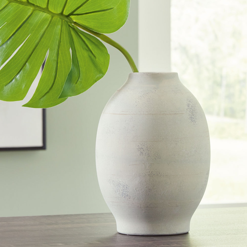 Dressed up with faux florals or standing alone, this vaseâ€™s trend-right sage green finish makes a chic impression. Ceramic craftsmanship gives it a timeless feel. What an artful addition to your tablescape, bookshelf or mantel.<br/><br/><b>Product Featu