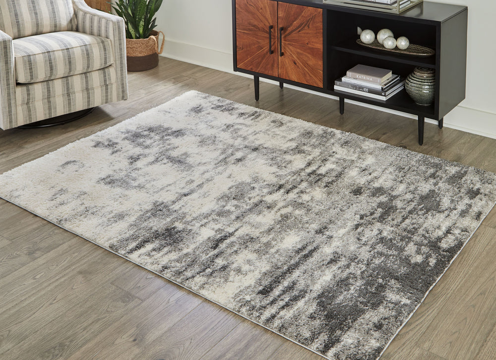 This area rug persists at the forefront of contemporary design. With an abstract design in shades of cream, gray and charcoal, it presents itself as the superlative choice to update your decor space.<br/><br/><b>Product Features</b><ul><li>Made of polyest