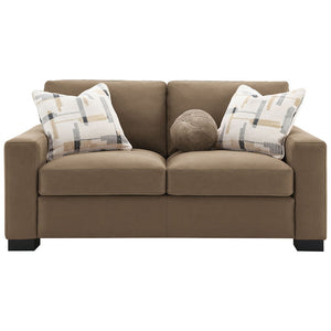  featuring plush pillows and wrapped in luxurious brown suede fabric. Its inviting design and soft