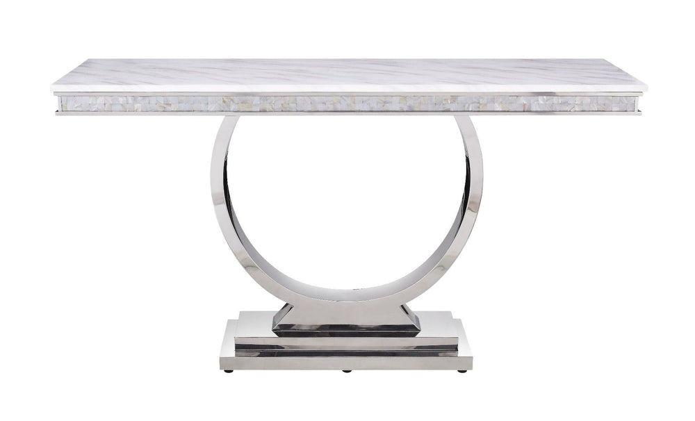 This beautiful contemporary work places a strong emphasis on lustrous materials that make a bold statement of personality and style. Shiny metal frame and white marble top complement each other perfectly, making the table more visually appealing. The Zand