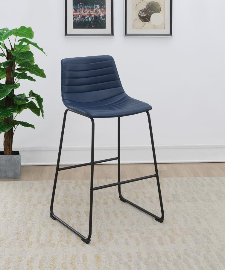 Upgrade kitchen or lounge seating with the refined look of a set of two contemporary barstools. Each boasts faux leather upholstery over a bucket style seat. Channel tufting adds a sense of depth and movement while highlighting intriguing color. The stool