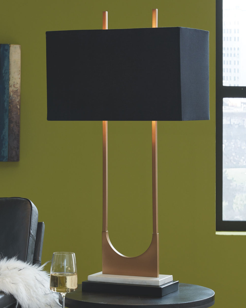 The open metal brass-tone frame adds elegant style to the look of this table lamp. It features a black rectangle shade, brass and black metal finish, white marble base and a 3-way switch. It is built with sheer perfection and adds a dazzling glow to your 