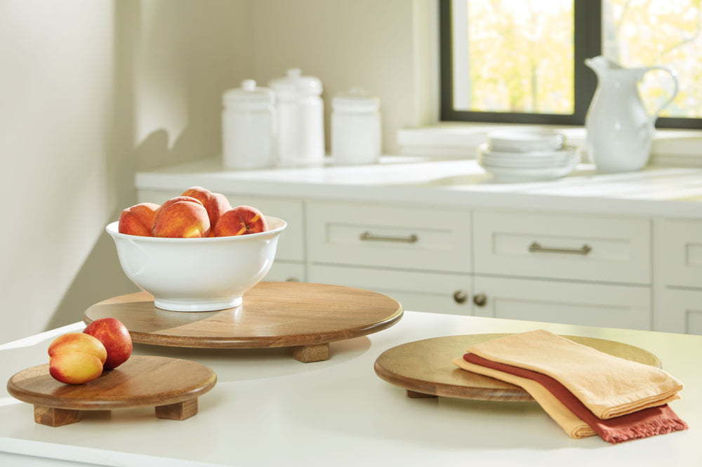 Serving up style has never looked so chic. Naturally beautiful, this tray set impresses with honey-hued wood full of warm, rich character. With three different sizes, you can use the tray that best suits your charcuterie board or hors d-'oeuvres spread. O