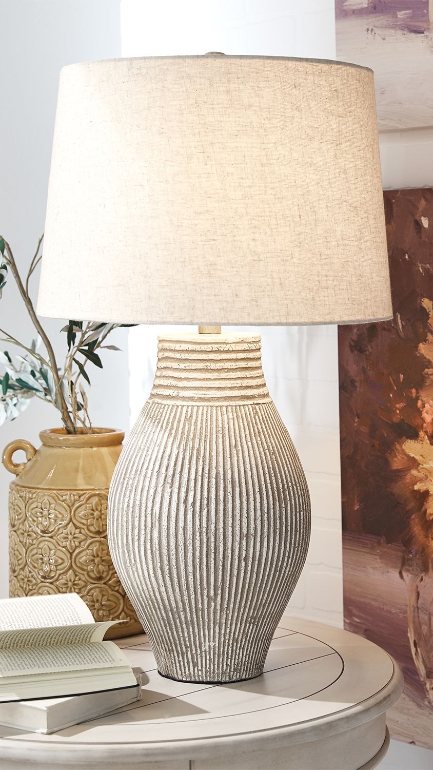 With its textural elements and neutral hues, this table lamp is a natural fit for so many spaces. Paper composite base with organic texture feels wonderfully at home.<br><br><b>Additional Dimensions</b><br><ul><li>Shade: 0-"</li><li>Base: 0-"</li><li>Cord