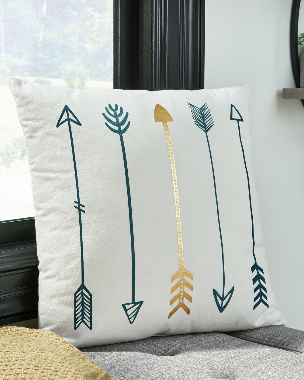Add a distinctive piece of decor to your room with this accent pillow. Adorned with a pattern of arrows in teal, white and metallic goldtone, this striking print adds a splash of style to any decor. Featuring a cotton cover with knife edge construction an