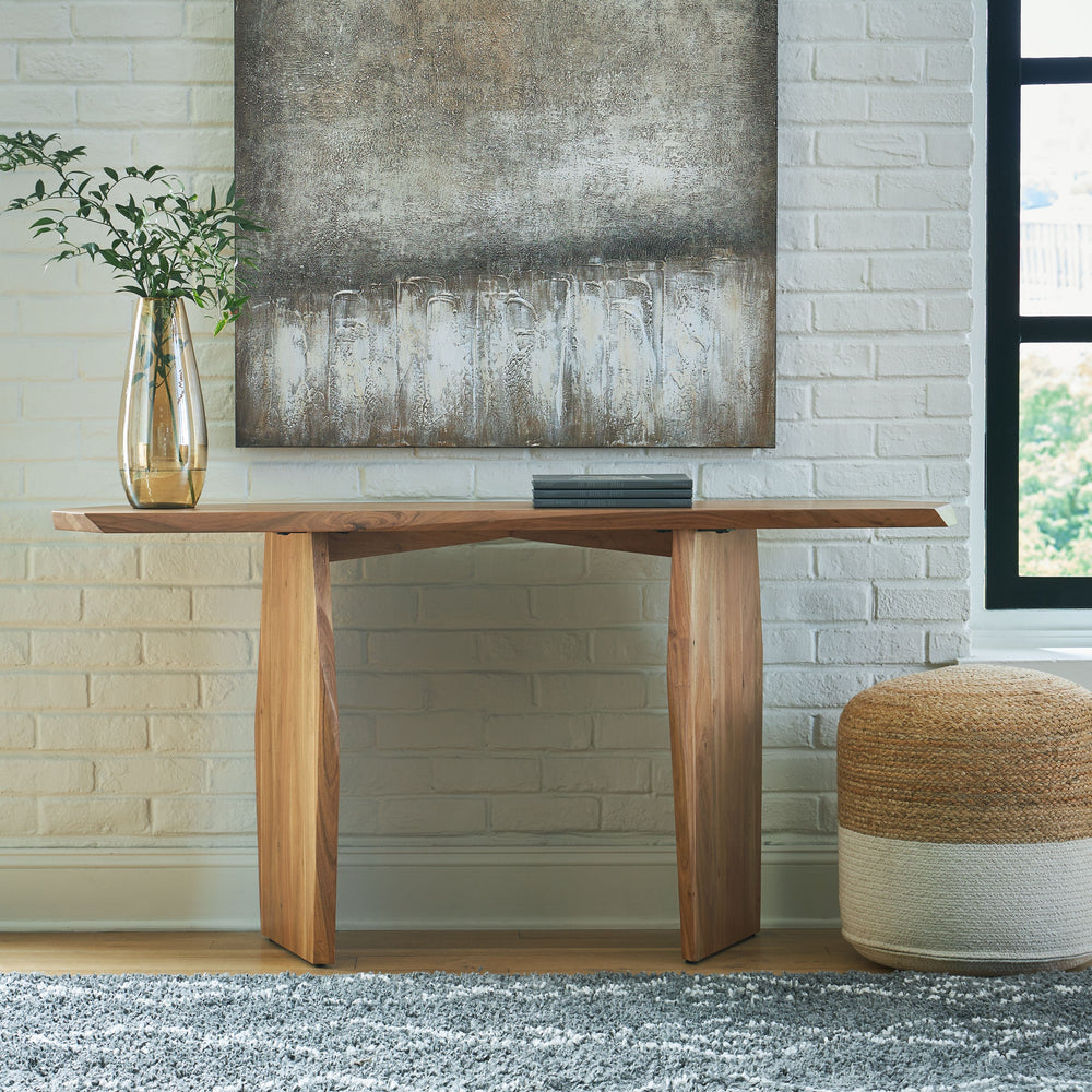 In a word â€¦ wow. With its irregularly shaped top and legs, this console table is a spectacular study in contemporary style. The imaginative piece brings nature indoors, with solid wood in a relaxed natural finish that appeals to your earthy sensibilitie