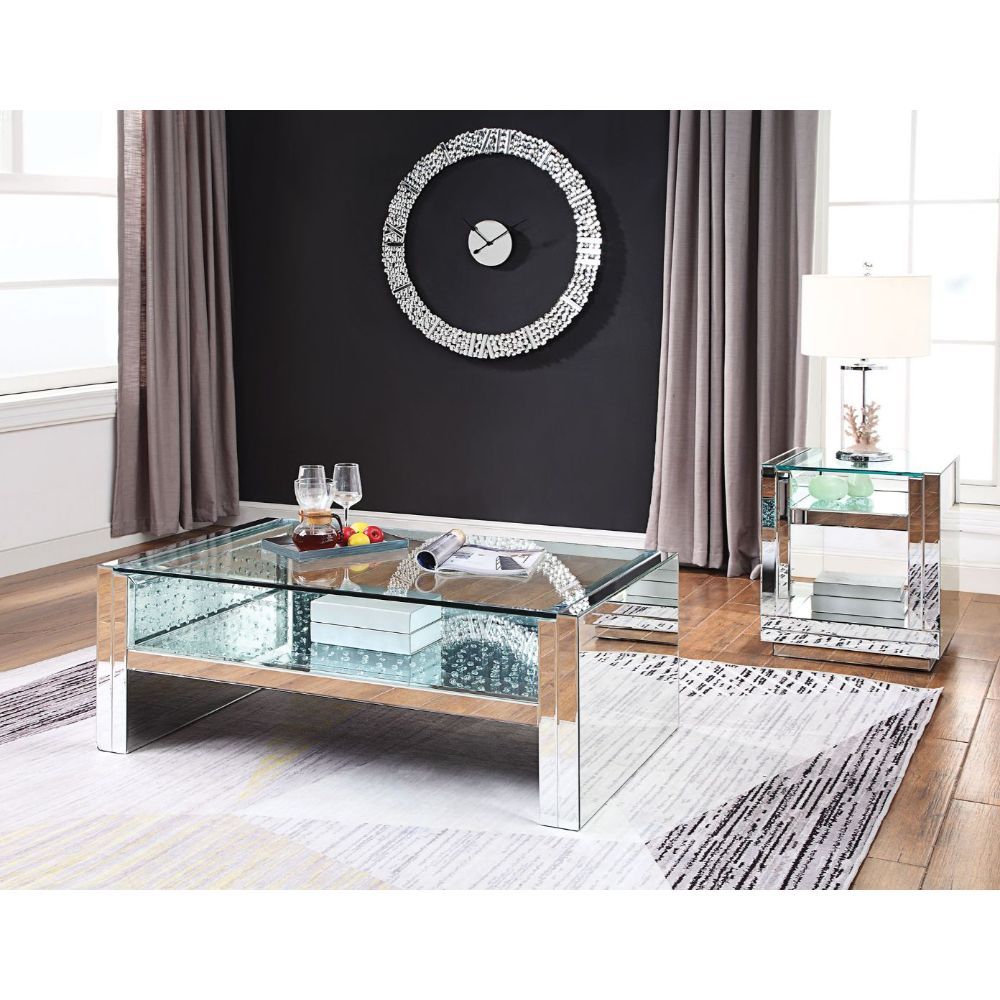The Nysa Coffee Table will add a contemporary touch to any room in your home. With its clean lines, this brilliant rectangular occasional table showcases a distinctive style for an intriguing look. The table features a fully mirrored sled base with an exq
