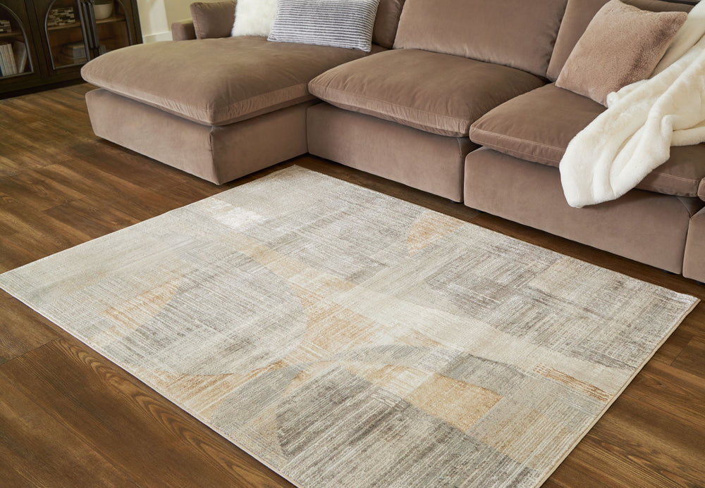 This abstract rug is crafted to captivate. Its interplay of linen, gray and caramel hues creates a chic masterpiece suited to both modern minimalist and warm traditional aesthetics. With its chic character, this rug anchors your space with sophistication 