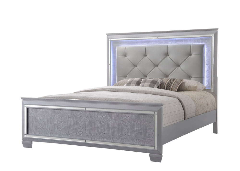 This bedroom collection offers a touch of glamour and luxury to any home. The chic silver finish paired with elegant textured panels creates a sophisticated look that can elevate any bedroom decor. The bed is a statement piece, featuring a stunning tufted