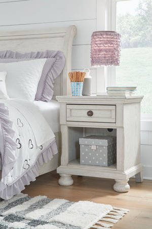  timeless furnishings take your bedroom to the next level. Nothing does that better than this nightstand. The antiqued white finish with a wonderful grain texture radiates sophistication