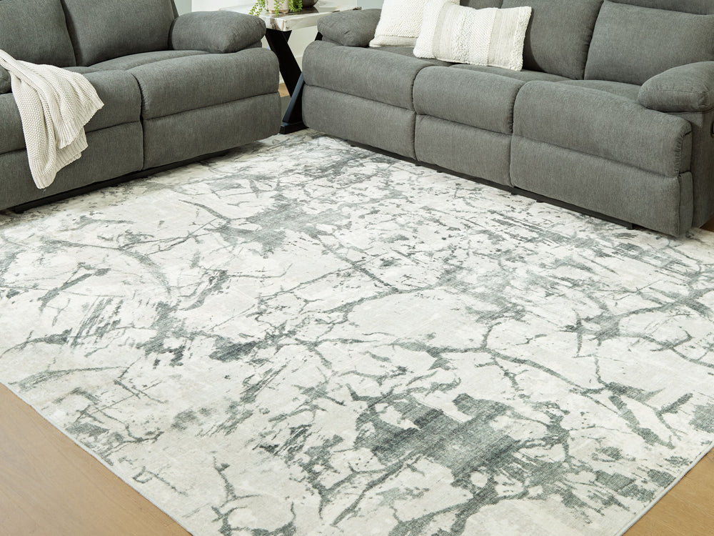Make a statement that effortlessly complements your modern sensibilities. This rug adds an intentionally curated feel underfoot, with versatile shades of gray forming an intriguing abstract design. Crafted with comfort and convenience in mind, this soft f