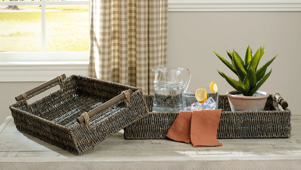 This tray set with cutout wood handles adds a lovely touch of natural appeal to nearly any room. Woven from seagrass in an antiqued gray finish, these lovely trays make a great pick for everything from displaying decorative elements to storing essentials 