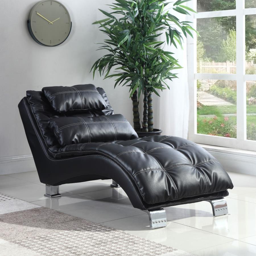 Impart ultimate relaxation with the refined look and plush feel of this upholstered chaise. Square tufting and double row stitching highlight black leatherette upholstery and create dimensionality. Complete with a delightful curve that cradles the body, t