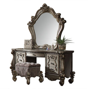 Assembled, Armless Stool (Backless/No Storage) Tight Seat Cushion w/Welted Trim Padded Seat: Button Tufted, Seat: Floral Pattern Fabric, Contrast Base: Stripped Pattern Fabric Scrolled Apron w/Nailhead Trim Scrolled Legs: Poly Resin with Antique Contrast 
