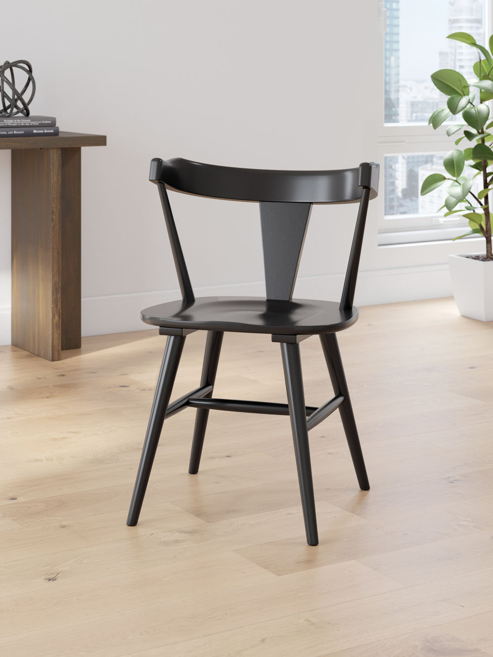 Small spaces donâ€™t mean you have to sacrifice big style. This chair sets the stage for casually cool dining. Its wrap-around back beautifully goes with the flow, while the black finish adds a layer of urban industrial flair. Merging everyday function wi