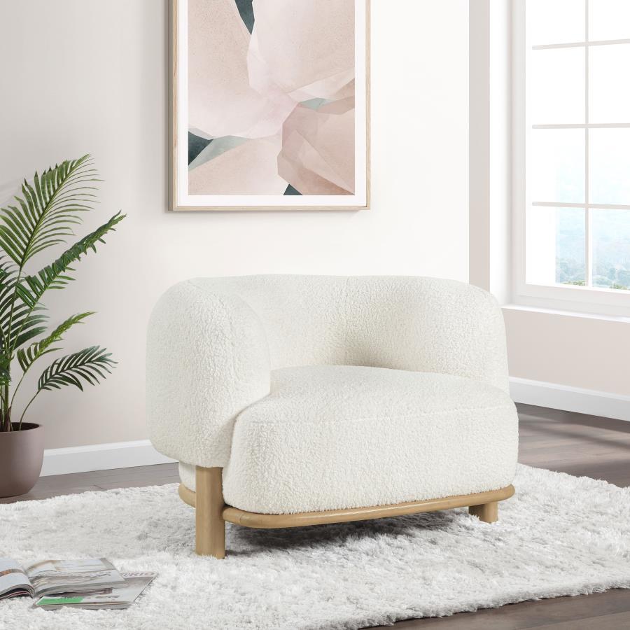 Build a refined, approachable living room aesthetic around this charming modern accent chair. It-'s a barrel back silhouette that impresses with strong, enduring lines that create a welcoming ambiance. Heavily textured upholstery adds neutral allure, perf