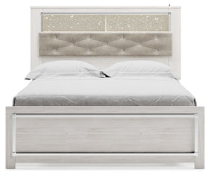  a pearlized finish and button-tufted upholstery bring a glam touch to the richly rustic appearance. Remote-co