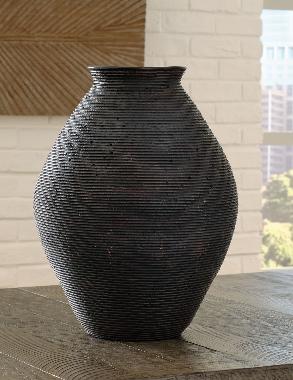 Ribbed textural rings give this vase a wonderful artisanal quality. An antiqued brown finish catches the eye, drawing attention to this elegantly earthy centerpiece.<br/><br/><b>Product Features</b><ul><li>Made of polyresin</li><li>Antiqued brown finish</