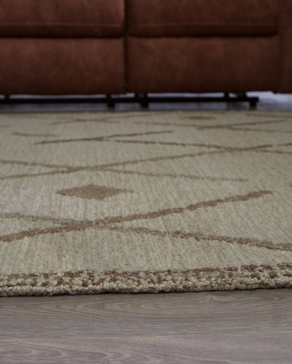  understated area rug masterfully combines design and durability. Hand-tufted for superior quality
