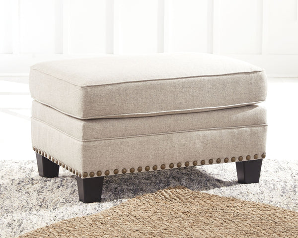  this ottoman in beige brings a fresh perspective to modern farmhouse living. Distinctive elements include nailhead trim and a lovely linen-weave upholstery for an up-t