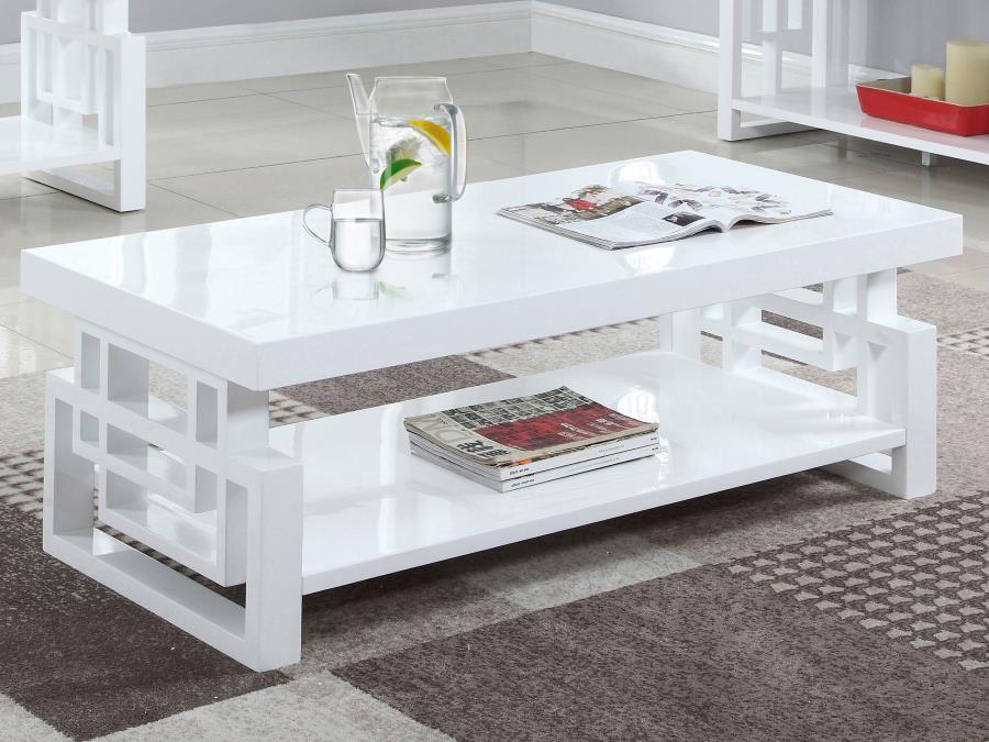This modern rectangular coffee table adds sleek style to any living room. Crafted from durable engineered wood, it boasts a pristine white high-gloss finish that reflects light beautifully. The open shelf below offers practical storage, while the geometri