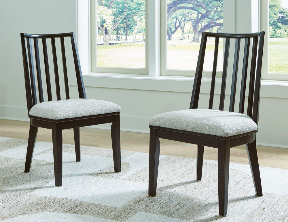 This dining chair brings a rustic vibe to urban contemporary design. Itâ€™s a modern approach to natural beauty, with an aged black finish defining the chic curved backrest. And the chairâ€™s color palette is stunningly simple, allowing it to coordinate s