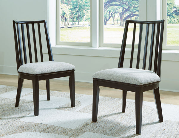  with an aged black finish defining the chic curved backrest. And the chairâ€™s color palette is stunningly simple