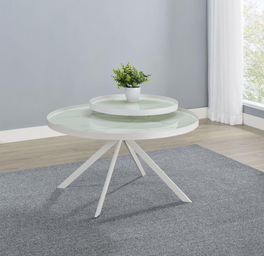 This modern two-tier coffee table features a sleek metal frame and tempered glass tops with marble-pattern printing for a refined aesthetic. Its multi-level design offers added functionality, perfect for displaying decor or organizing essentials. The stur