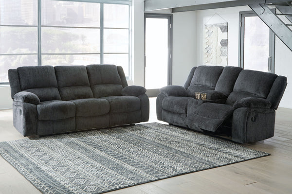 Built for luxury, this reclining set lets you kick back in reliable style. The thick, softly textured chenille upholstery provides a comfy surface on which to lounge. With bustle back construction and thickly cushioned armrests, this pieces gives you the 