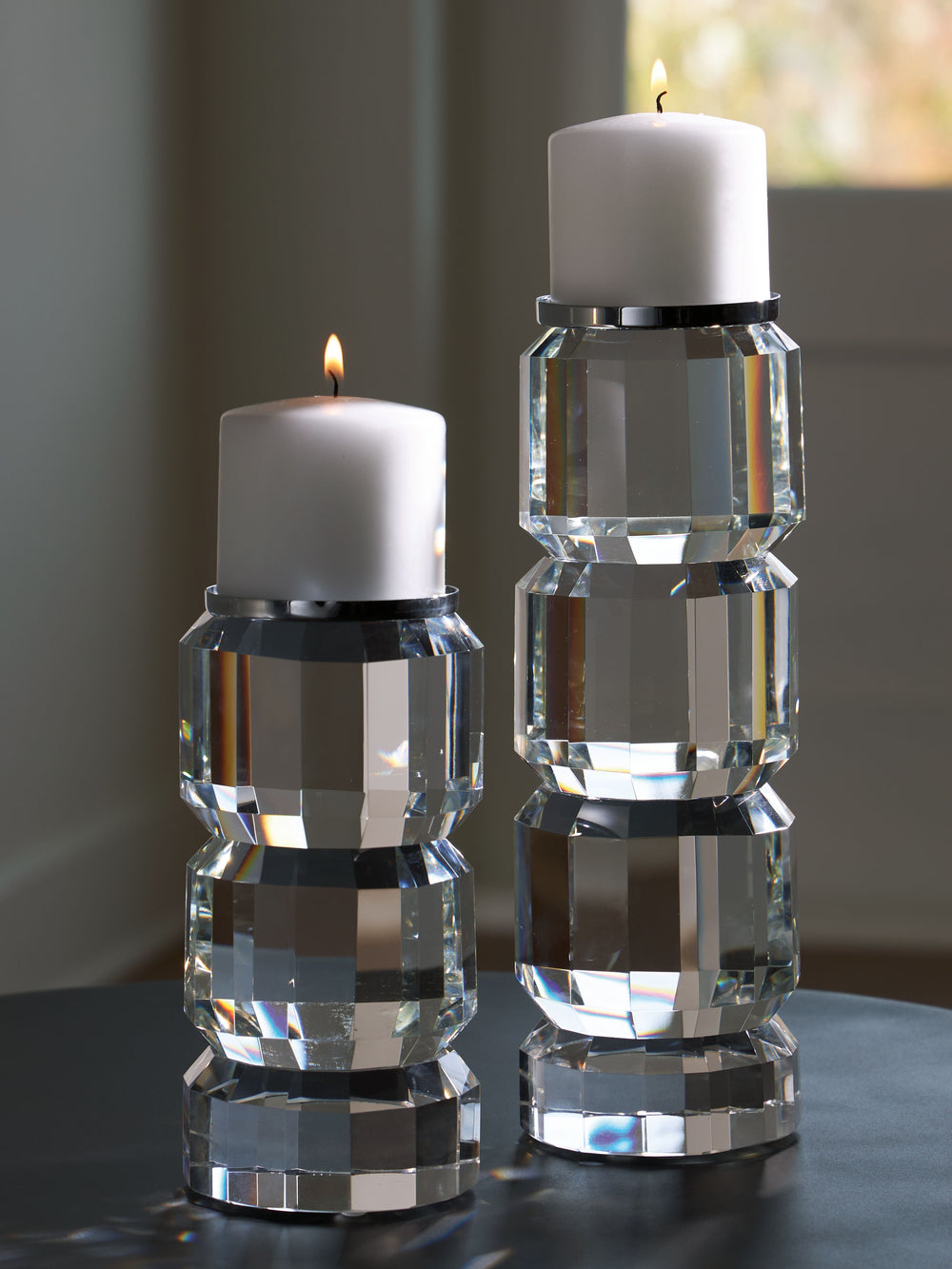 Clearly upscale and on-trend. Pairing crystal with silvertone metal accents, this candle holder set shines with a sophisticated sensibility. It-'s perfect for your contemporary design tastes.<br><br><b>Additional Dimensions</b><br><ul><li>Candle holder-la