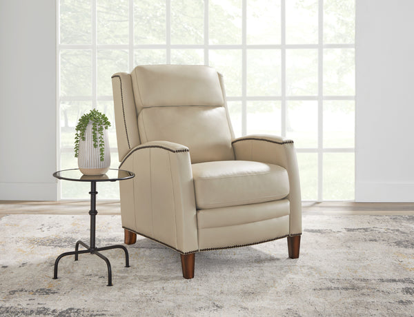 The Vermont power recliner offers a luxurious and effortless power pushback recline feature, allowing you to easily find the most comfortable position for relaxation. It is upholstered in soft leather with custom matching and features decorative nail head