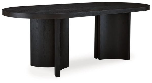 Informed by art deco design, this oval dining table makes a lasting impression in a simply stunning way. Its magnificent curved silhouette and architectural pedestal are enhanced with a rich layered black finish. Itâ€™s the contemporary statement piece yo