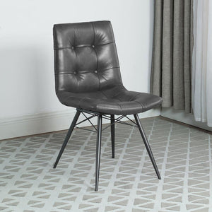  this dining side chair is a stylish addition to any dining space. Upholstered in charcoal faux leather