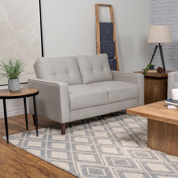  this loveseat boasts a perfect small-scale design. Its classic track arm and self-welt detailing highlight the superior tailoring. The grid-tufted boxed back cushions and pocket coil spring cushion construction 