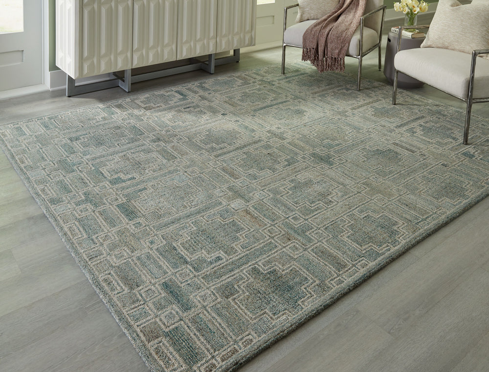 Tie your room together with the elegant character of this rug. Its timeless geometric design in muted tones provides a versatile foundation for interiors ranging from casual to modern. Youâ€™ll love the way the intricate design grounds your space without 