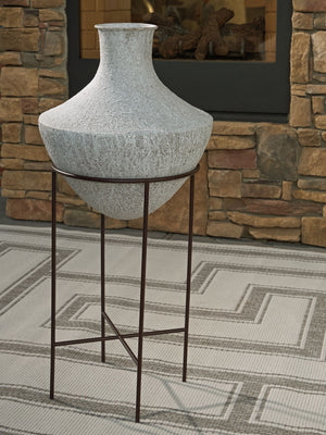  textured look in a neutral hue pairs with a variety of casual color palettes. An espresso brown stand adds charming contrast to the look. And this vase enthusiastically welcom