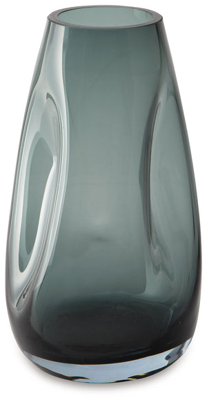 Sleek. Contemporary. Chic. This vase has an organic sense of movement, recalling seaside aesthetics with its teal glass. A stunning solo accent, it also acts as a beautiful vessel for florals and other decorative fillers. And the vase is safe for outdoor 