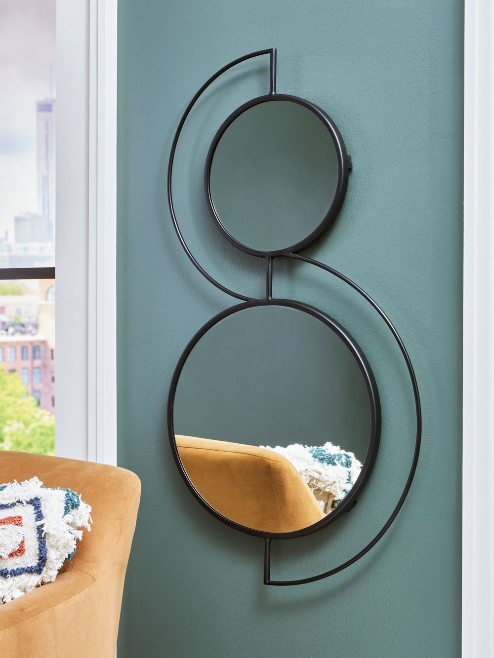 Talk about a cool turn on contemporary style. This accent mirror wows with round metal frames and stylishly curved accents that naturally go with the flow. More than a mirror, it-'s a work of art.<br><br><b>Additional Dimensions</b><br><ul><li>Inner mirro