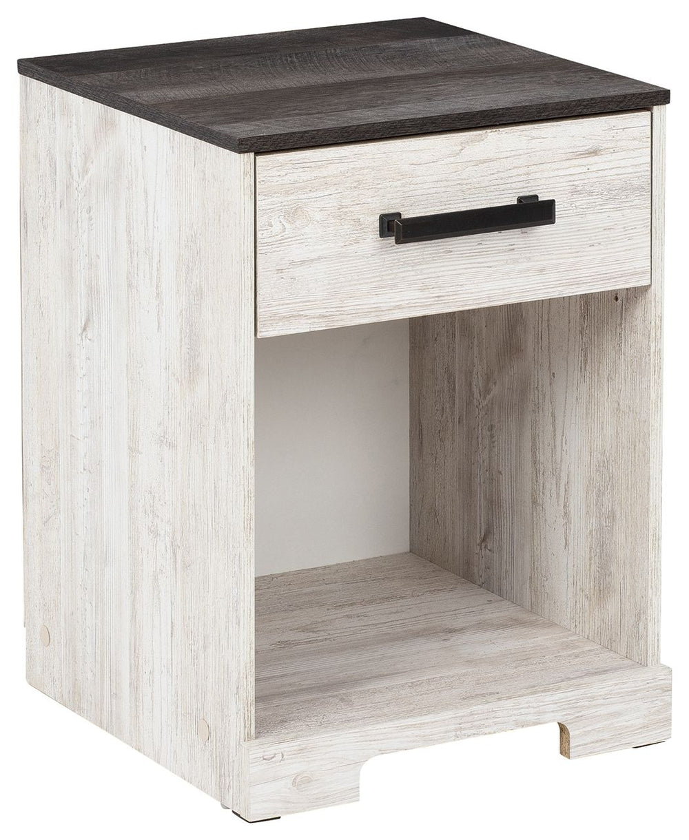 Give provincial a new meaning with the chic look of this nightstand. A two-tone finish keeps this piece light and fresh, while the warm pewter-tone hardware adds an industrial touch. The open cubby provides display space or accommodates a storage bin to a