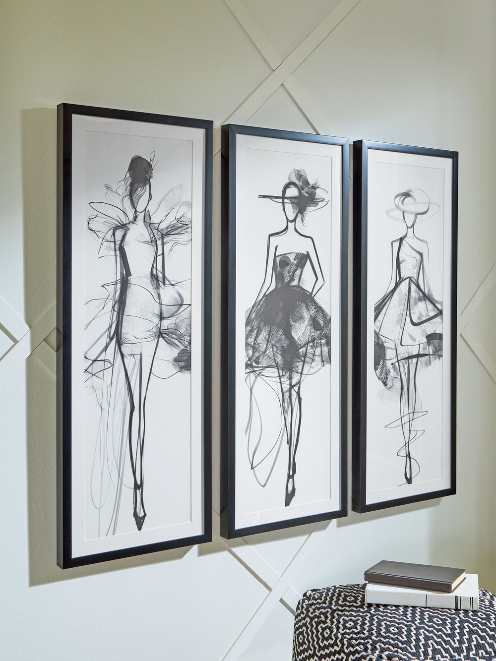Put your passion for fashion on display. Showcasing three trendy sketch figures, this wall art set brings the luxe, contemporary feel of city living to your space. Hang the pieces separately or together to make a chic statement.<br/><br/><b>Product Featur