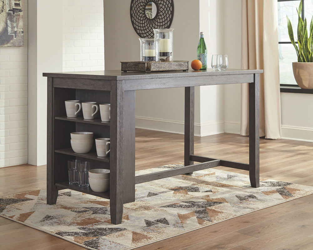 Casual lifestyle design constructed with Acacia veneer and solids. Finished in an antiqued gray wash color. X-back chairs feature solid wood frame and cushioned seat covered with a gray textured polyester fabric with nail head trim. Matching backless benc