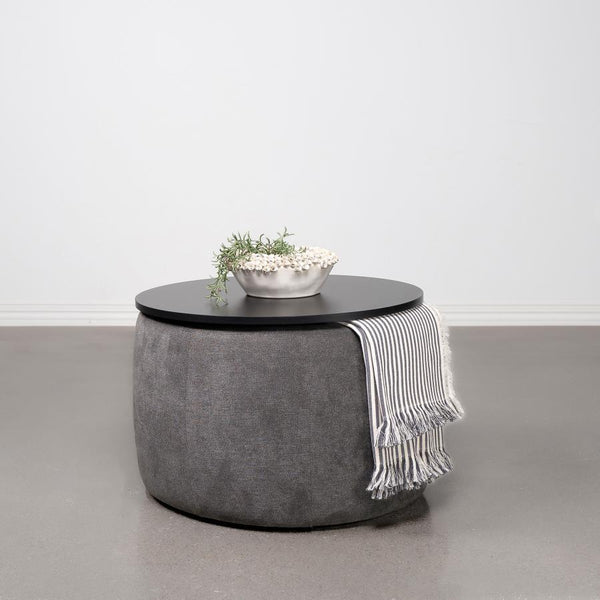  it invites relaxation while concealing a spacious storage compartment beneath its sleek black lift-top. Its subtle charm is el