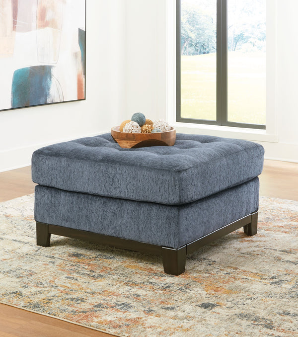  on-trend style meets functionality in this oversized accent ottoman. Details like a tufted top cushion and wrap-around accent base reflect your urban contemporary tastes while staying versatile as your style changes. And with its soft upholstery