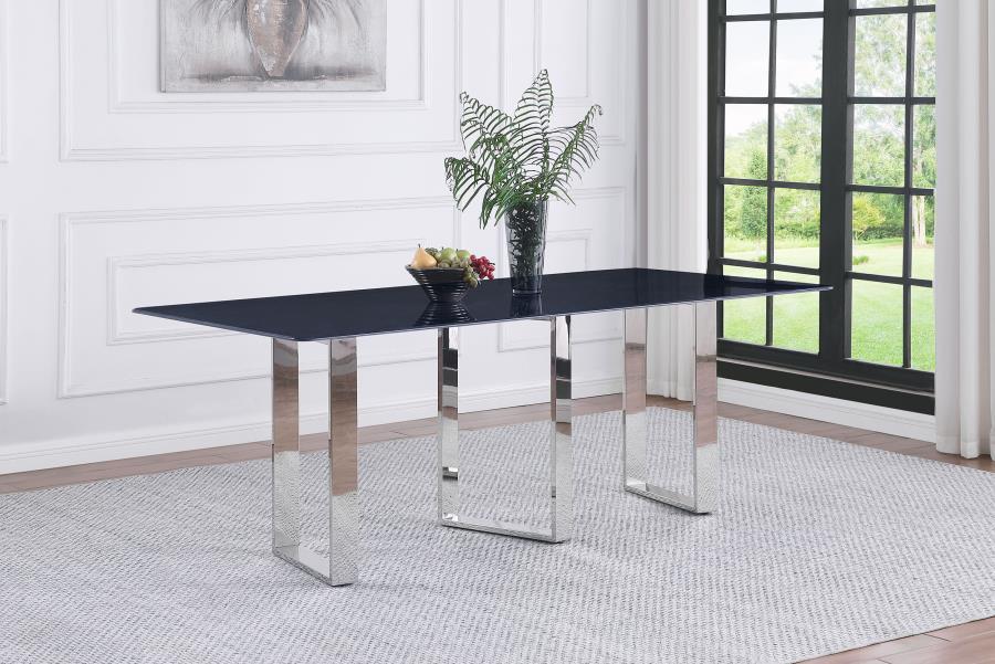 Inject a sense of sophistication with a modern rectangular dining table. Featuring a sintered stone tabletop with a gray marble finish and slim, sleek silhouette, the table becomes a stylish centerpiece in your dining room. It stands on three open frame l