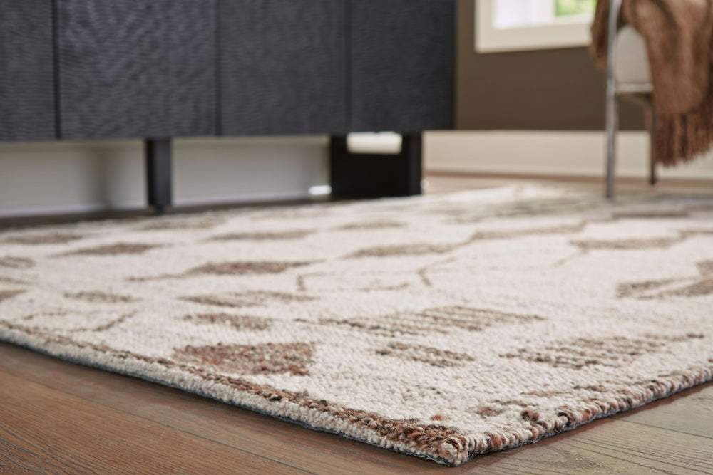 With its striking geometric design, this area rug knows how to make a subtle statement. Its shades of beige and brown are a welcome complement underfoot that doesnâ€™t overtake your roomâ€™s decor. This beautiful rug infuses a laid-back sensibility that s