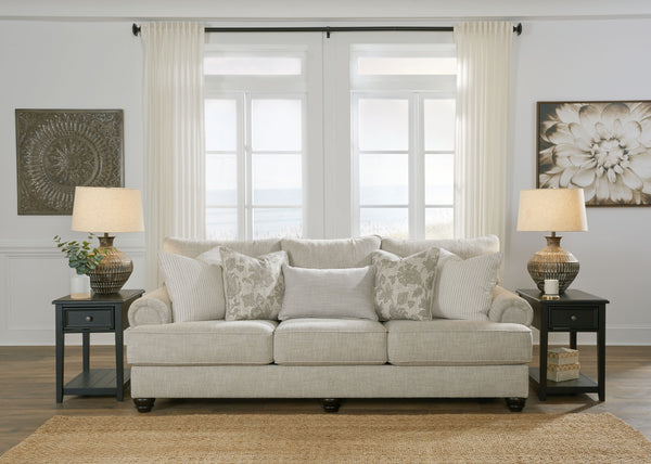  easygoing hue is enhanced by even lighter flax peeking through. Distinctive roll arms add a dab of debonair